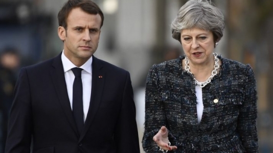 Macron si May au semnat un tratat privind controlul imigratiei la frontiera comuna